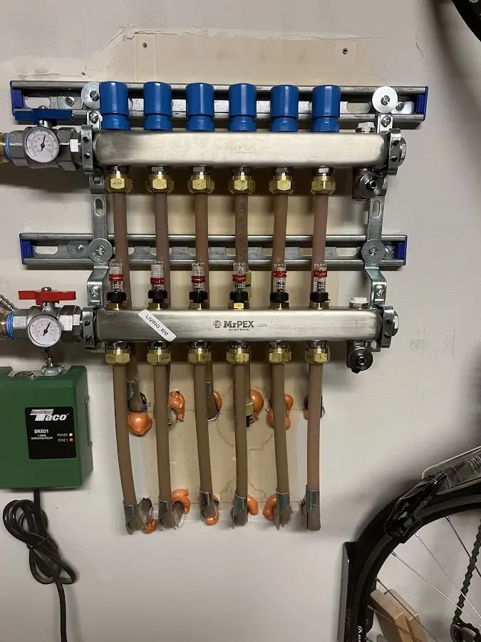 Plumber performing Water Heater Repair at a residential property in Tolono